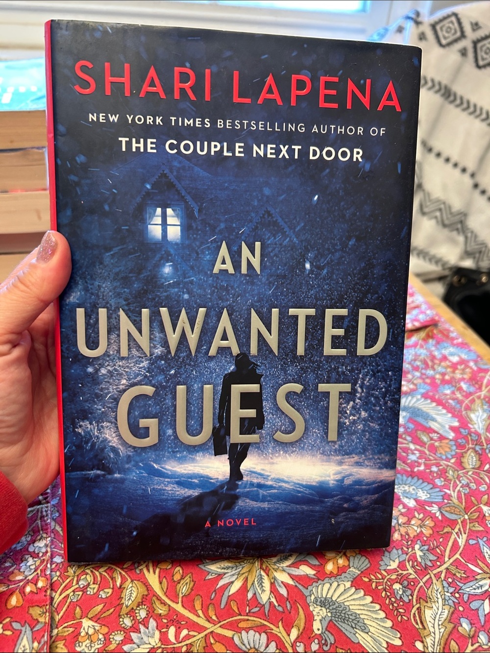 An Unwanted Guest  by Shari Lapena Blue Hardcover Novel